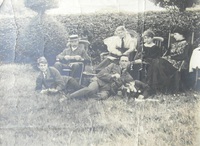 Richard William Tuddenham seated back left; his wife Kate Amelia seated far right; and their sons William Reginald (b.1904) & Robert John (b.1909) are lying on the grass, far left and right respectively.